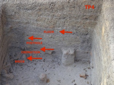 Figure 7. Yahanda mound test pit 4, south section with former wooden floor and post-hole descending from context 4 into 6, touching the cremation burial surrounded by bricks; © Janice Stargardt.